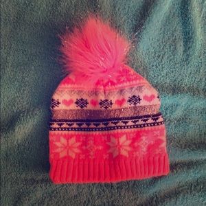A pink beanie good for cold days